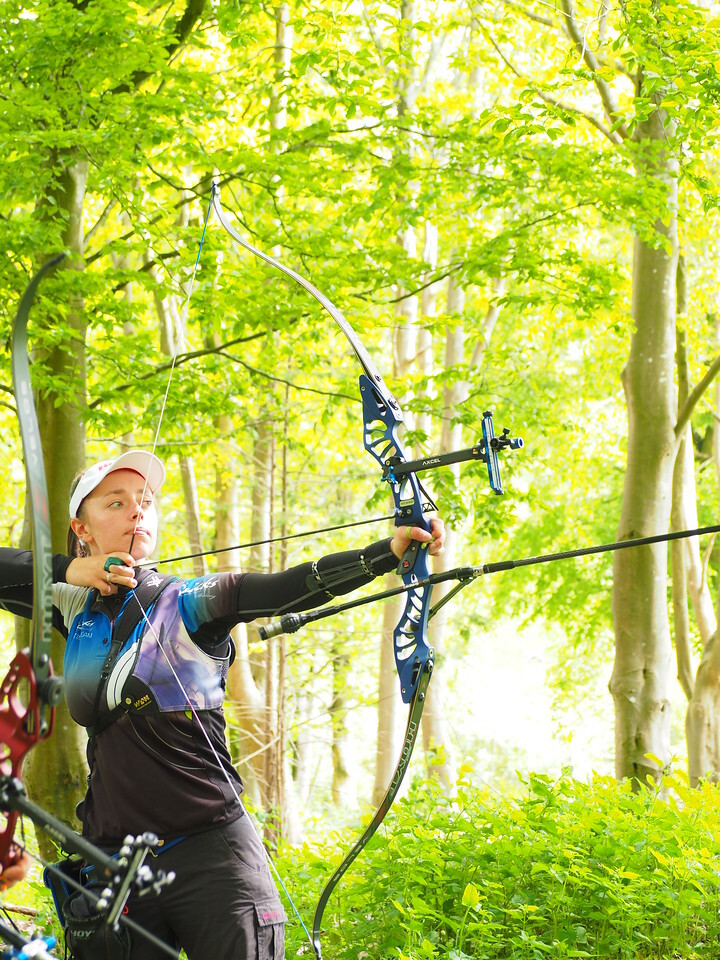 Archer shooting in a forest